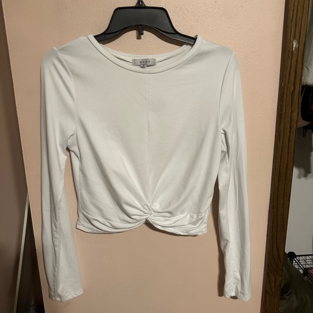 White long sleeved shirt w tie in front giving it very small cropped nice w jean